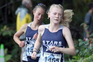 Soldotna's Sophia Jedlicki leads Tania Boonstra at the George Plumley Invite at Palmer High School in Palmer, Alaska, on Saturday, Sept. 6, 2025. (Photo by Jeremiah Bartz/Frontiersman)