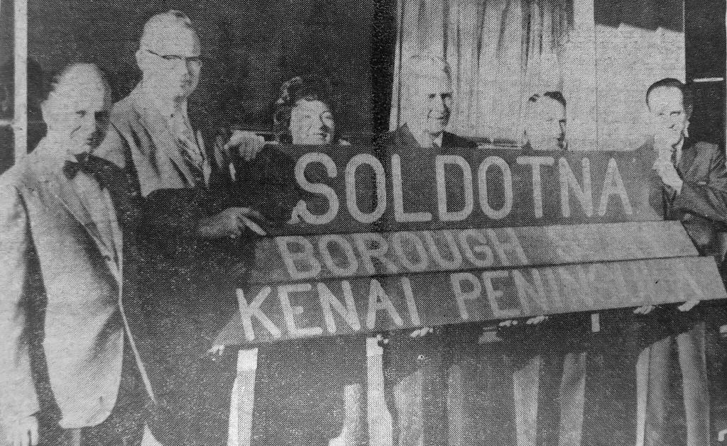 Soldotna was heavily promoted at the best location for the seat of government in the new Kenai Peninsula Borough. One of the key local promoters, seen in this old newspaper photo, was Dr. Paul Isaak (far left).