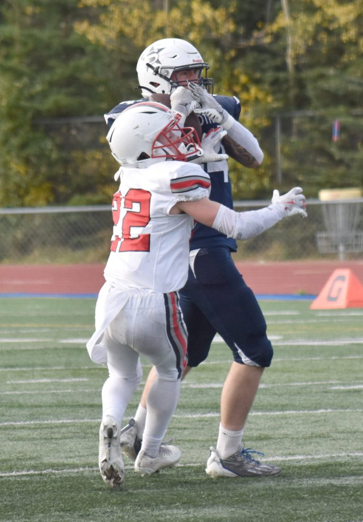 Soldotnas Logan Myers catches a pass while Wasillas Adam Corneliussen defends Friday, Sept. 19, 2025, at Justin Maile Field at Soldotna High School in Soldotna, Alaska. (Photo by Jeff Helminiak/Peninsula Clarion)