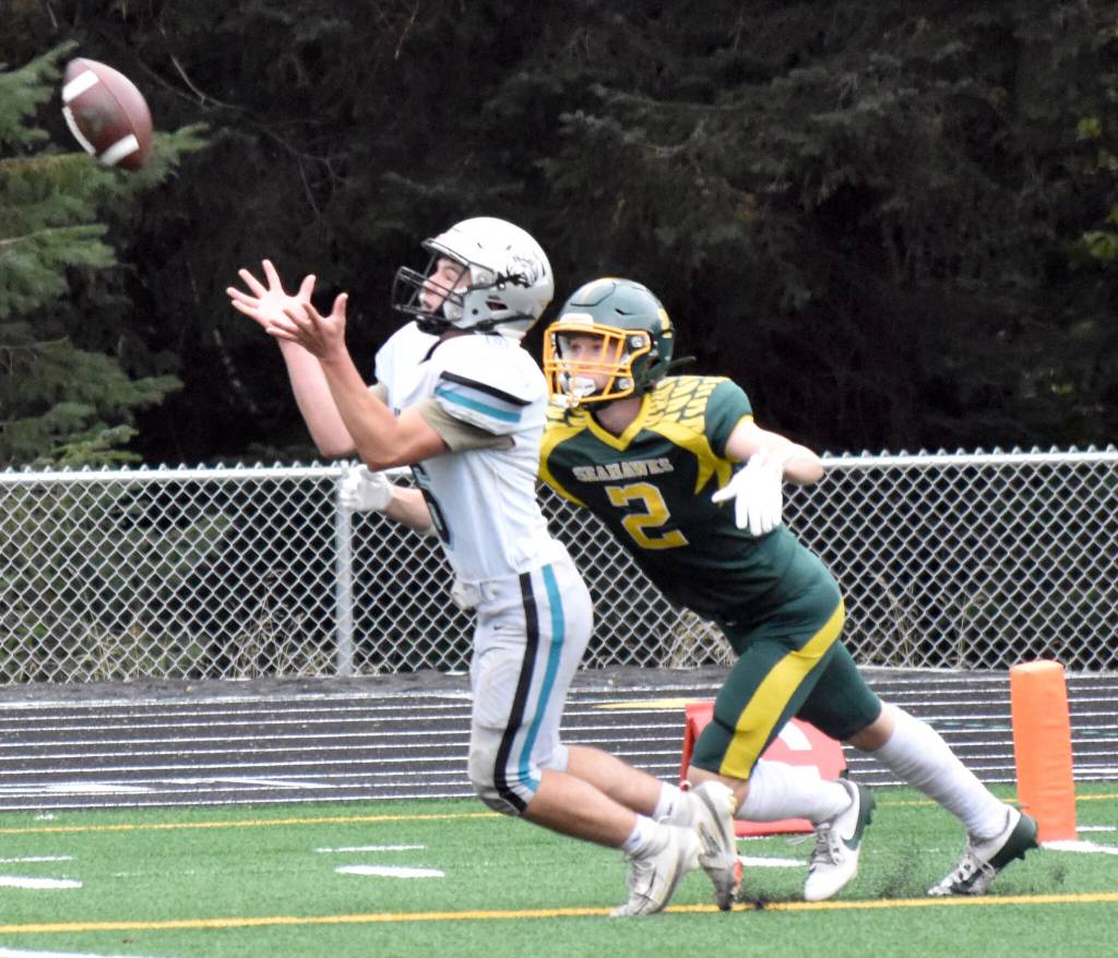Nikiskis Kaiden Parrish steps in front of Sewards Lane Petersen for an interception Friday, Sept. 26, 2025, at Seward High School in Seward, Alaska. (Photo by Jeff Helminiak/Peninsula Clarion)