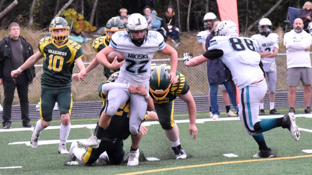 Nikiskis Ryder Maguire battles for yards against Seward on Friday, Sept. 26, 2025, at Seward High School in Seward, Alaska. (Photo by Jeff Helminiak/Peninsula Clarion)