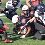 Kenai Centrals Ezra Jusmable recovers a fumble by Homers Justus Grimes on Saturday, Sept. 27, 2025, at Ed Hollier Field at Kenai Central High School in Kenai, Alaska. (Photo by Jeff Helminiak/Peninsula Clarion)