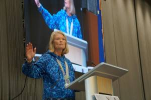 U.S. Sen. Lisa Murkowski, R-Alaska, speaks on Oct. 18, 2025, at the Alaska Federation of Natives convention in Anchorage. Behind her is a screen projeting her image as she speaks. (Photo by Yereth Rosen/Alaska Beacon)