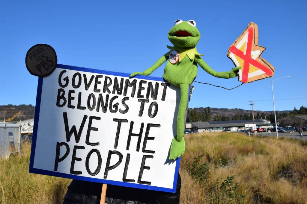 A sign carried by a protester during the No Kings demonstration on Saturday, Oct. 18, 2025, in Homer, Alaska, reads Government belongs to We the People.