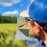 A participant in Cook Inletkeeper’s Mapping Salmon Habitat Solution eyes a baby salmon during a field day in August 2025. Every year, Cook Inletkeeper creates programs designed to get community members involved with mapping salmon habitat. Photo courtesy of David Knight, Cook Inletkeeper