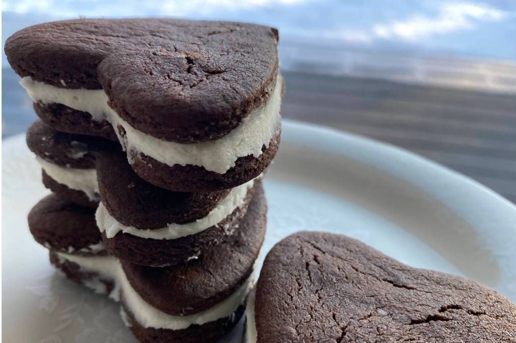 These heart-shaped chocolate sandwich cookies go perfectly with a glass of milk. (Photo by Tressa Dale/Peninsula Clarion)