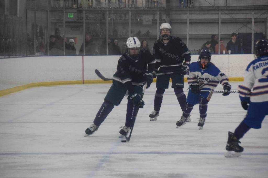 Homer player Nico Erickson (6) pursues a Soldotna Stars player with the puck during the Carlin Cup home varsity game on Saturday, Dec. 13, 2025, at the Kevin Bell Arena in Homer, Alaska. (Delcenia Cosman/Homer News)