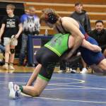 Sewards Atlin Ryan wrestles against a Mountain City Christian Academy athlete during the regional Kachemak Conference Wrestling Championships on Saturday, Dec. 13, 2025, at Homer High School in Homer, Alaska. (Delcenia Cosman/Homer News)