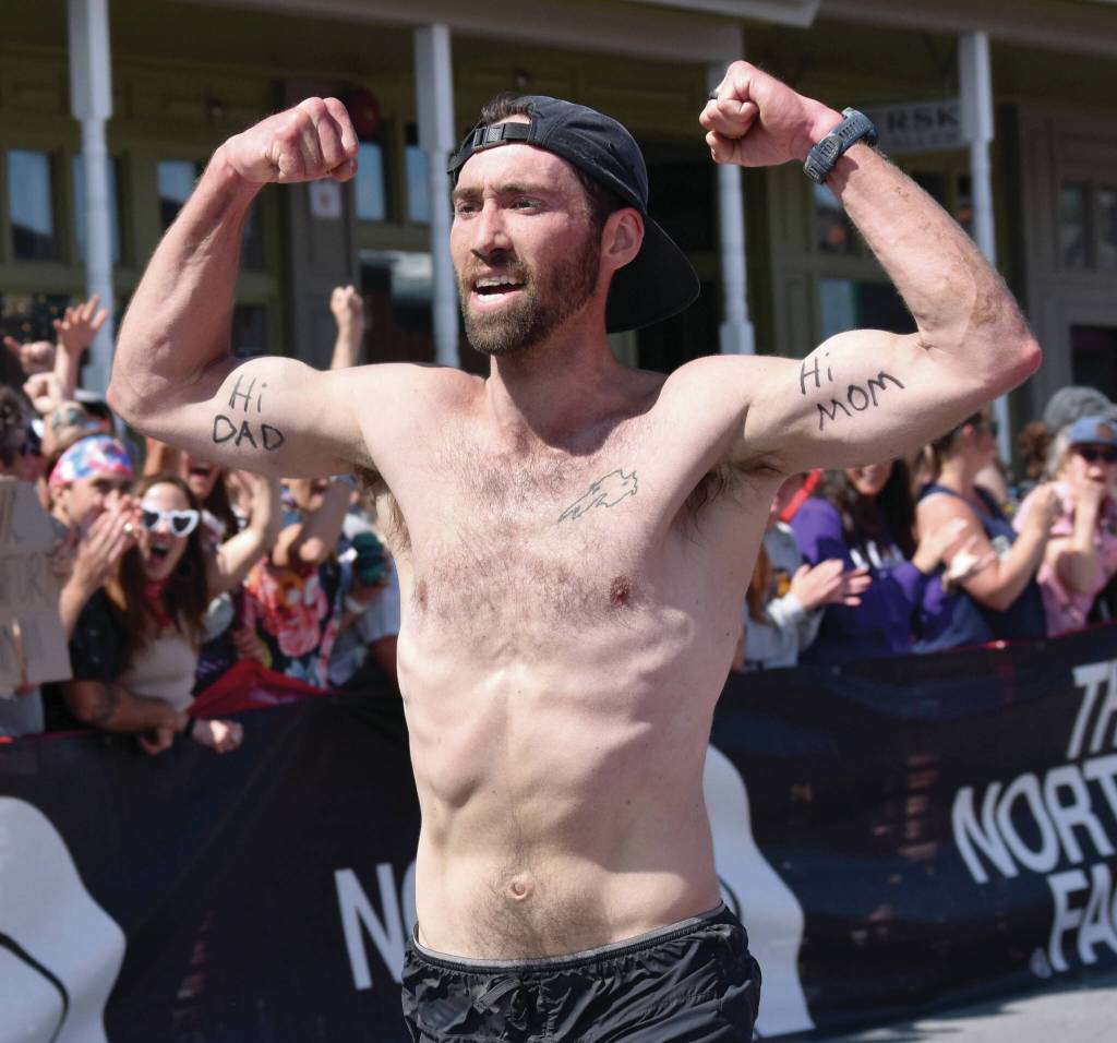 Photo by Jeff Helminiak/Peninsula Clarion James Carlberg, 34, of Seward finishes the mens race at the Mount Marathon Race on Friday, July 4, in Seward.