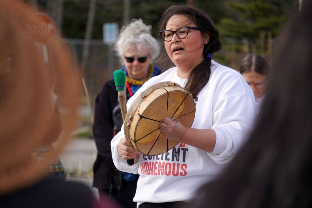 Kenaitze Indian Tribe chemical dependency councilor Jamie Ball performs during a candlelight vigil marking National Day of Awareness for Missing and Murdered Indigenous Women and Girls at the Raven Plaza, Ggugguyni Tuh, in front of the Denaina Wellness Center in Kenai, Alaska, on Monday, May 5, 2025. (Jake Dye/Peninsula Clarion)