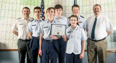 The Kenai Composite Squadron of the Alaska Wing, Civil Air Patrol is pictured on Jan. 26, 2026 with the first place state award from the CyberPatriot National Youth Cyber Defense Competition. Photo courtesy of Nickolas Torres