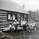 Photo from the Alaska State Library historical collection
This is the Riddiford School and three of its students (including Nick Lean in the center), circa 1938. The school was begun shortly in the Cooper Landing area shortly after the communitys first post office was created and named for Charles A. Riddiford. Neither institution lasted long.