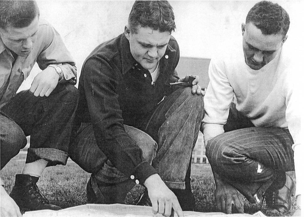 Photo from Naptowne: The Kids Story, by Carla Petrovich Rusk and Pete Petrovich
(from left to right) Indianapolis residents George Ray Stone and Alex and George Petrovich, circa 1947, study a map of the central Kenai Peninsula, where they plan to make their new home. They became some of the earliest homesteaders in what is now known as Sterling.