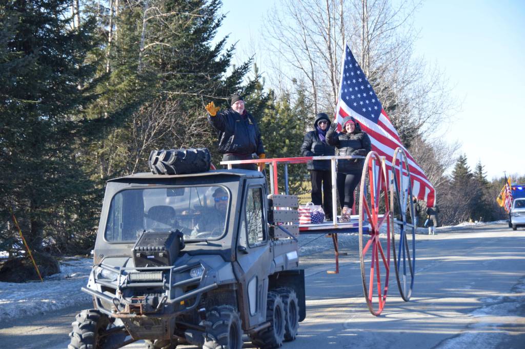 VFW Post 10221 Cmdr. Chuck Collins (left), canteen manager Heidi Adams (right) and other community members lead the annual Snow Rondi parade on Saturday, Feb. 28<ins>, 2026,</ins> in Anchor Point<ins>, Alaska</ins>. (Delcenia Cosman/Homer News)