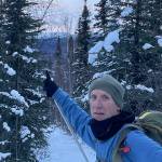 Ken Geiser of Fairbanks points to a live marten he saw clinging to the top of a birch tree off the Elliot Highway in December 2024. Photo courtesy Ned Rozell