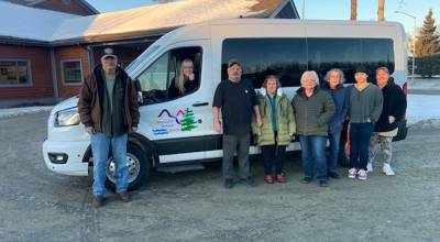 Staff at Soldotna Senior Citizens, Inc. are pictured on Dec. 17, 2025 in Soldotna, Alaska, in front of a new 15-passenger van purchased with funds the Rasmuson Foundation and several local businesses donated to the nonprofit organization. Photo courtesy of Soldotna Senior Citizens, Inc.