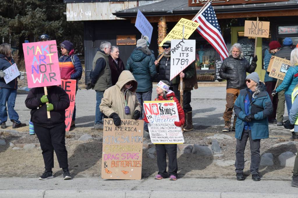 Community members line up along Pioneer Avenue for the third nationally-organized No Kings protest on Saturday, March 28, 2026, in Homer, Alaska. (Delcenia Cosman/Homer News)