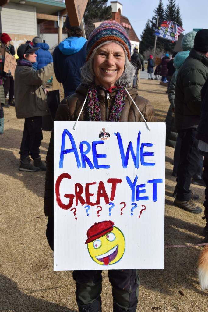 Melisse Reichman wears a sign that reads, Are We Great Yet?? during the No Kings protest on Saturday, March 28, 2026, in Homer, Alaska. (Delcenia Cosman/Homer News)