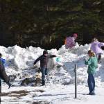 Kids clamber over snow banks at the VFW Post 10221 during their annual community Easter egg hunt on Sunday, April 5, 2026, in Anchor Point, Alaska. (Delcenia Cosman/Homer News)