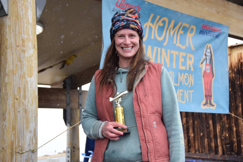 Christine Marlowe from Anchor Point holds up her seventh place trophy during the 32nd annual Homer Winter King Tournament on Saturday, April 4, 2026, in Homer, Alaska. (Delcenia Cosman/Homer News)