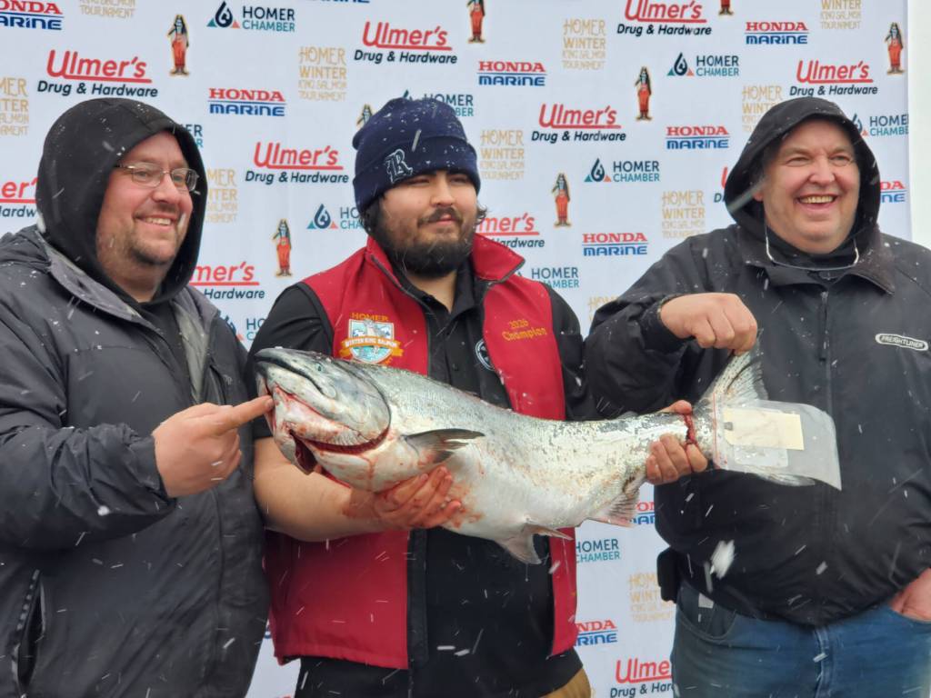 Photos by Delcenia Cosman / Homer News
Michael Ardenia (center) holds up his winning fish with his team members during the 32nd annual Homer Winter King Tournament on Saturday, April 4, 2026, in Homer, Alaska.