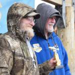 Stephen M. Krause (left) from Soldotna holds up his fourth place trophy during the 32nd annual Homer Winter King Tournament on Saturday, April 4, 2026, in Homer, Alaska. (Delcenia Cosman/Homer News)