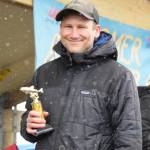 Bo Calhoun holds up his fifth place trophy during the 32nd annual Homer Winter King Tournament on Saturday, April 4, 2026, in Homer, Alaska. (Delcenia Cosman/Homer News)