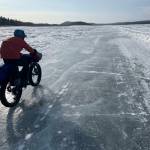 Ned Rozell rides a plowed winter road on the Yukon River that allows cars and trucks to drive between Manley Hot Springs and the village of Tanana in the winter. Photo courtesy Forest Wagner