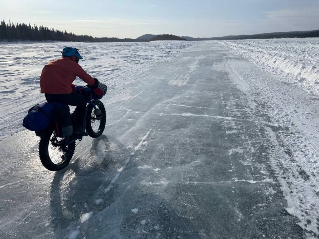 Ned Rozell rides a plowed winter road on the Yukon River that allows cars and trucks to drive between Manley Hot Springs and the village of Tanana in the winter. Photo courtesy Forest Wagner