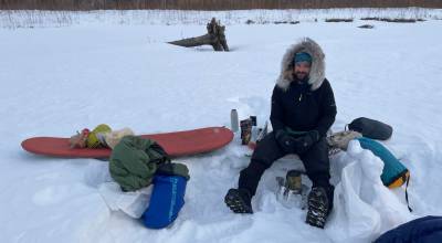 Forest Wagner melts snow to hydrate meals at a campsite on the Yukon River between the villages of Ruby and Tanana on April 2, 2026. Photo courtesy Ned Rozell