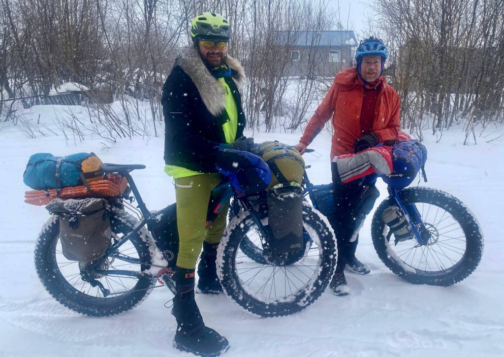 Forest Wagner, left, and Ned Rozell reach the village of Kaltag on the Yukon River on April 7, 2026. They are attempting to pedal fat bikes from Fairbanks to Nome. Photo courtesy Chris Carlson