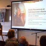 Ingrid Johnson, associate professor in the University of Alaska Fairbanks Department of Justice & Womens Gender and Sexuality Studies, gives a presentation on violence against women in Alaska during the "Duffys Journey to Justice" community conversation at Kachemak Bay Campus on Saturday, May 2, 2026, in Homer, Alaska. (Delcenia Cosman/Homer News)