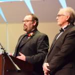 Homer High School choir director Kyle Schneider (left) and retired choir director Mark Robinson (right) give a pre-concert lecture on the Mozart "Reqiuem" on Saturday, May 1, 2026, in the Homer High School Mariner Theatre in Homer, Alaska. (Delcenia Cosman/Homer News)