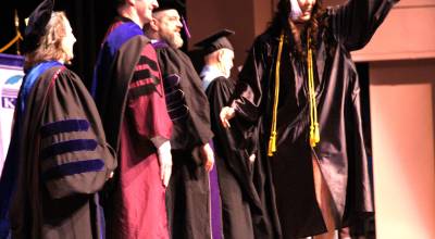 Alyssa Koester-Backstrom crosses the stage upon receiving her Associate of Applied Science degree during the Kenai Peninsula College commencement ceremony held Thursday, May 7<ins>, 2026,</ins> at Kenai Central High School<ins> in Kenai, Alaska</ins>. Photo courtesy Summer Lazenby/Kenai Peninsula College