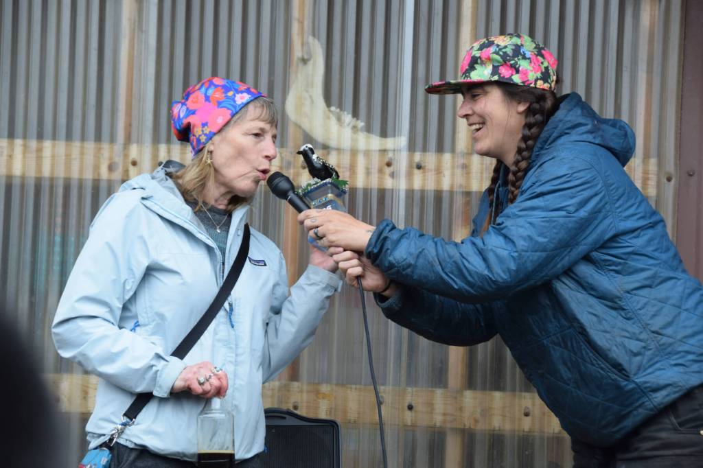 Bonnie (left) reenacts her award-winning raven imitation at the ninth annual Shorebird Festival bird calling contest on Saturday<ins>, May 9, 2026,</ins> at the Homer Brewing Company<ins> in Homer, Alaska</ins>. (Delcenia Cosman)