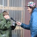 Thor, 7, from Homer (left) reenacts his snipe winnowing imitation for emcee Mallory Primm (right) and the audience gathered for the ninth annual Shorebird Festival bird calling contest on Saturday, May 9<ins>, 2026,</ins> at the Homer Brewing Company<ins> in Homer, Alaska</ins>. Thor won an award for the Serious youth category in the contest. (Delcenia Cosman/Homer News)
