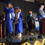 Graduating seniors cross the stage to receive their diplomas during a commencement ceremony on Monday, May 18<ins>,</ins> <ins>2026</ins>, in the Homer High School Alice Witte Gymnasium<ins> in Homer, Alaska</ins>. (Delcenia Cosman/Homer News)
