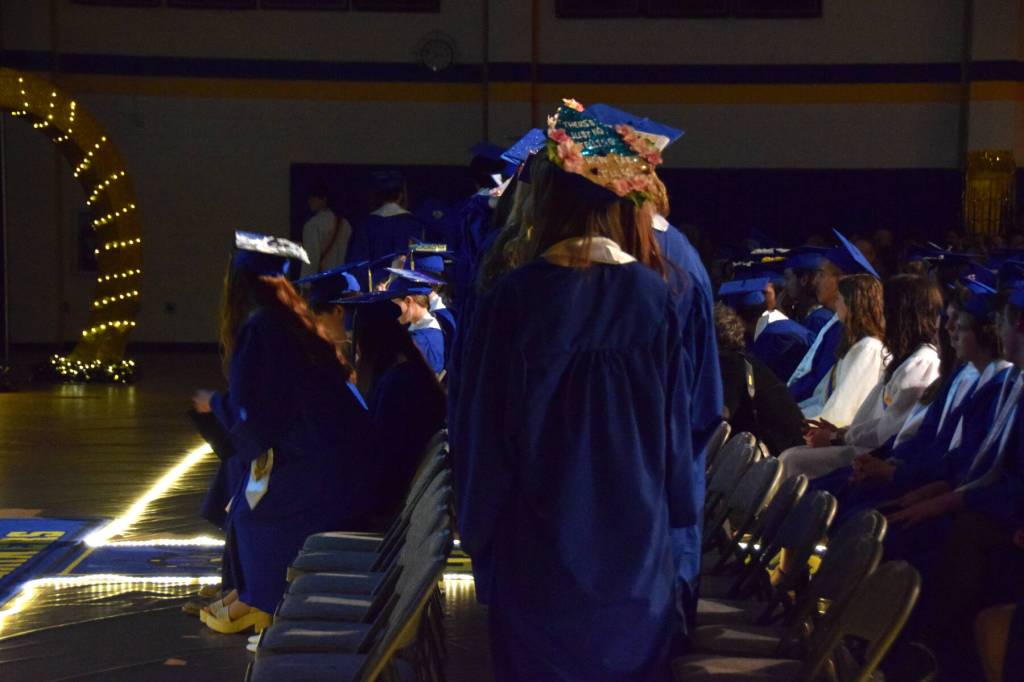 Members of the Homer High School graduating class line up to proceed to the stage and receive their diplomas during a commencement ceremony on Monday, May 18<ins>, 2026,</ins> in the Homer High School Alice Witte Gymnasium<ins> in Homer, Alaska</ins>. (Delcenia Cosman/Homer News)