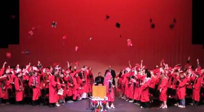 The Kenai Central High School graduating class of 2026 toss their caps into the air at the close of their commencement ceremony on Wednesday, May 20<ins>, 2026, in Kenai, Alaska</ins>. Screenshot.
