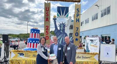Derotha Ferraro (SPH director of public relations and marketing), Kenai Peninsula Borough Mayor Peter Micciche, and Ryan Smith (SPH CEO) gather on July 2 for an employee event before the community celebration on July 3. (South Peninsula Hospital)