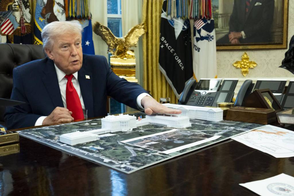 Doug Mills/The New York Times 
FILE  President Donald Trump with a model of his proposed ballroom, in the Oval Office of the White House in Washington, Dec. 12, 2025.