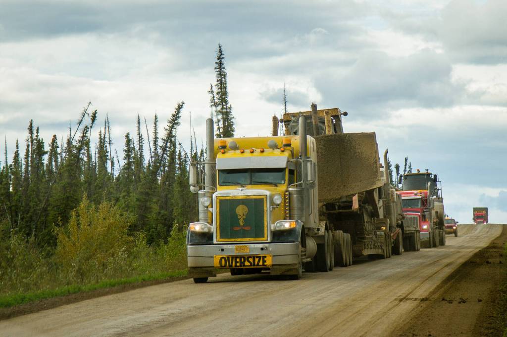 Large trucks traveling to and from Deadhorse and Prudhoe Bay dominate the Dalton Highway. (Photo by Arthur T. LaBar)