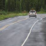 UAF photo by Sam Bishop 
A pickup negotiates bumps on a recently patched stretch of Ballaine Road in Goldstream Valley north of Fairbanks.
