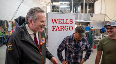 Governor Mike Dunleavy shares a laugh with Mike Rowe and Bay Weld employee Kele Bottineau in Homer July 23 as Wells Fargo provided $250,000 for the Alaska Vocational and Technical Center. (Courtesy of Wells Fargo)