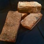 Photo by Clark Fair
These four Russian bricks were made in Kenai sometime between 1841 and 1866. Currently, they reside in the collection of historical items in the Kenai Visitors & Cultural Center.