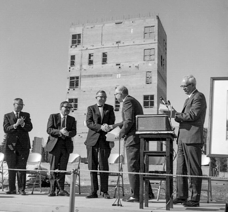 University President William Wood shakes C.T. Elveys hand at ceremonies to dedicate the Elvey Building in May 1969. (Photo from Geophysical Institute archives)